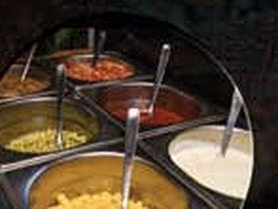The sauce bar: trays of sauces and toppings